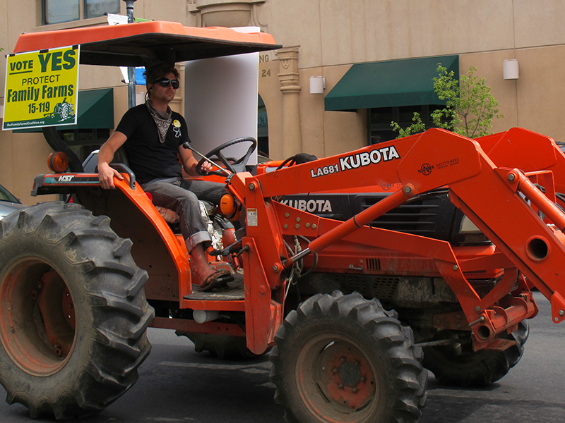 Dairy farmer during Tractor Brigade through downtown Medford